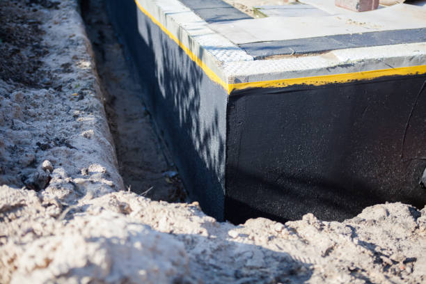 Professional Waterproofing technician working in West Newton, PA